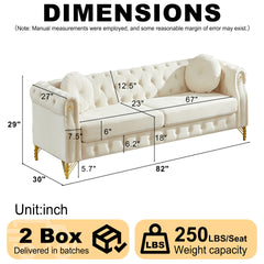 82-Inch Velvet Chesterfield sofa with two round pillows, featuring copper stud detailing and tufted button accents, with metal legs. Loop design allows for hanging cartoon ornaments.