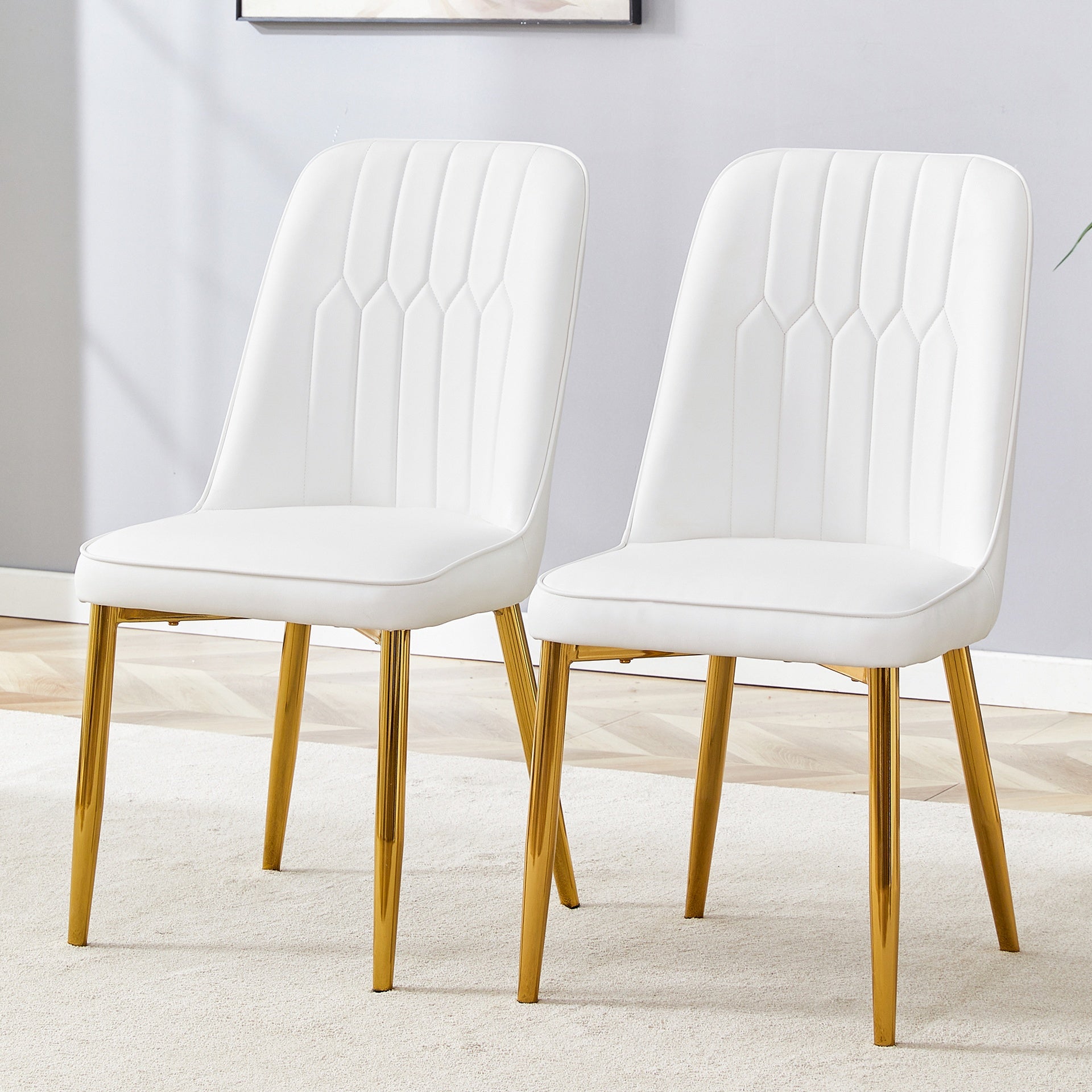 2 modern dining chairs, sleek PU leather backrest, and gold metal legs bring a comfortable home experience to the kitchen, bedroom, and office.W1151P183322