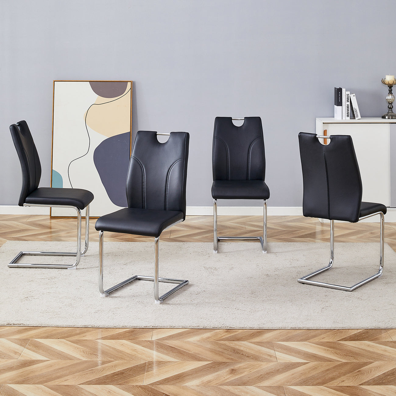 Black PU Dining Chair Set.Uniquely designed black dining chairs. PU material, paired with silver metal chair legs. Suitable for offices, restaurants, kitchens, conference rooms, etc.(Set of 4)