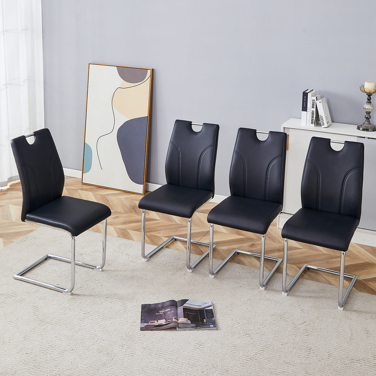 Black PU Dining Chair Set.Uniquely designed black dining chairs. PU material, paired with silver metal chair legs. Suitable for offices, restaurants, kitchens, conference rooms, etc.(Set of 4)