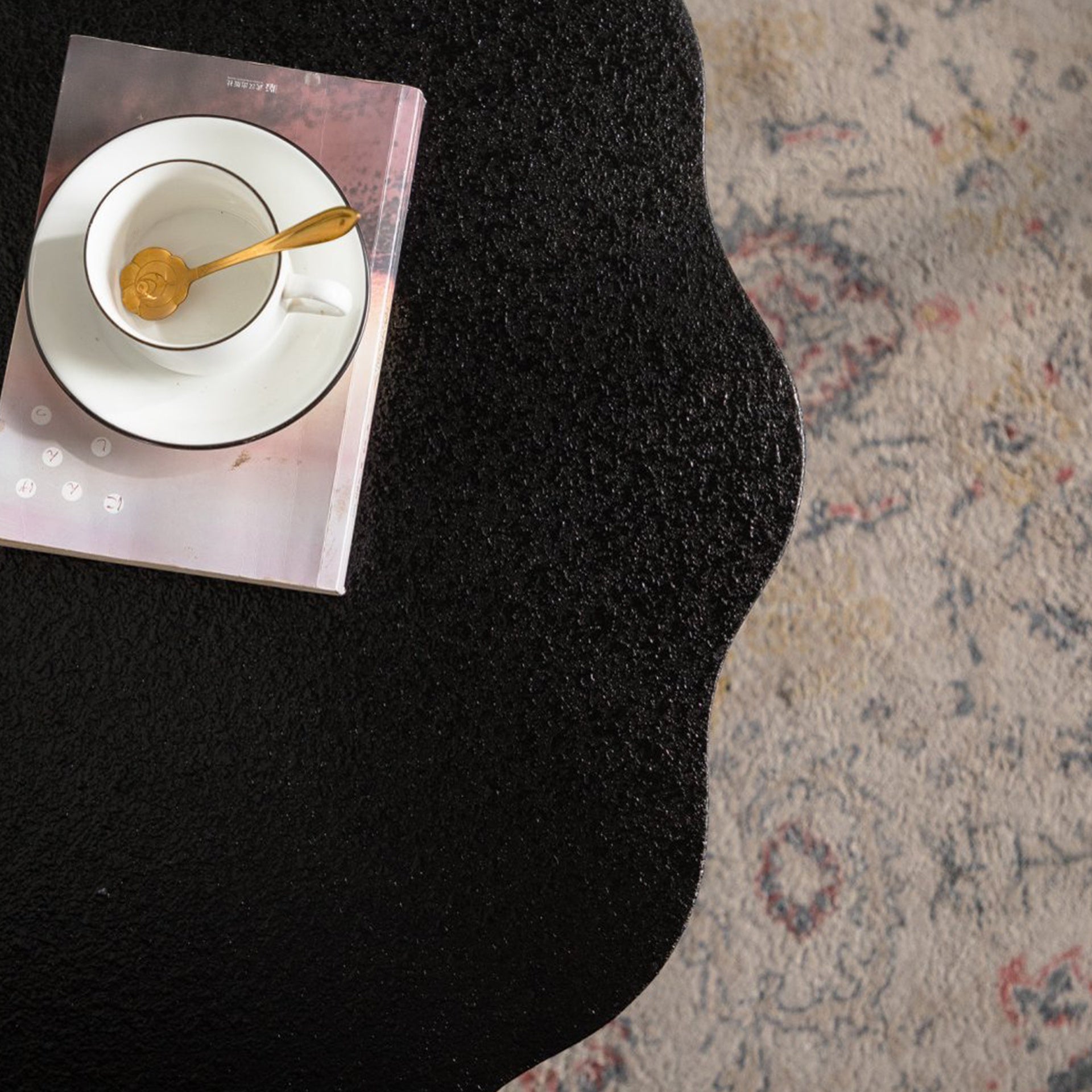Scalloped Black Coffee Table: Unique Wave-Edge Shape, Elegant Focal Piece for Stylish Spaces.