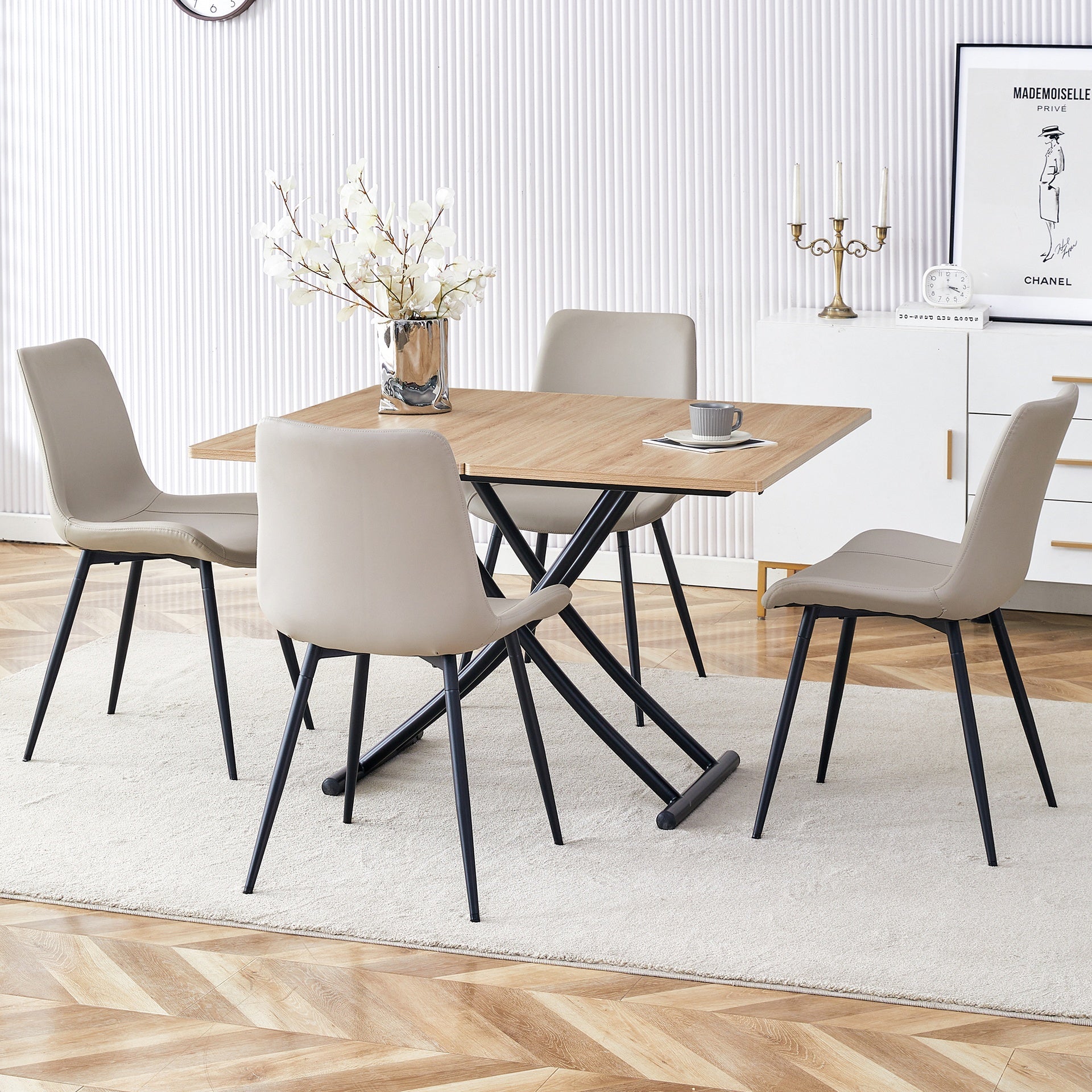Table and chair set.Modern Multifunctional Lifting Platform,Light Wood Grain Sticker MDF Desktop,Black Metal Legs. Paired with 4 Light Gray Artificial PU Chairs With Curved Widened Cushion Design.