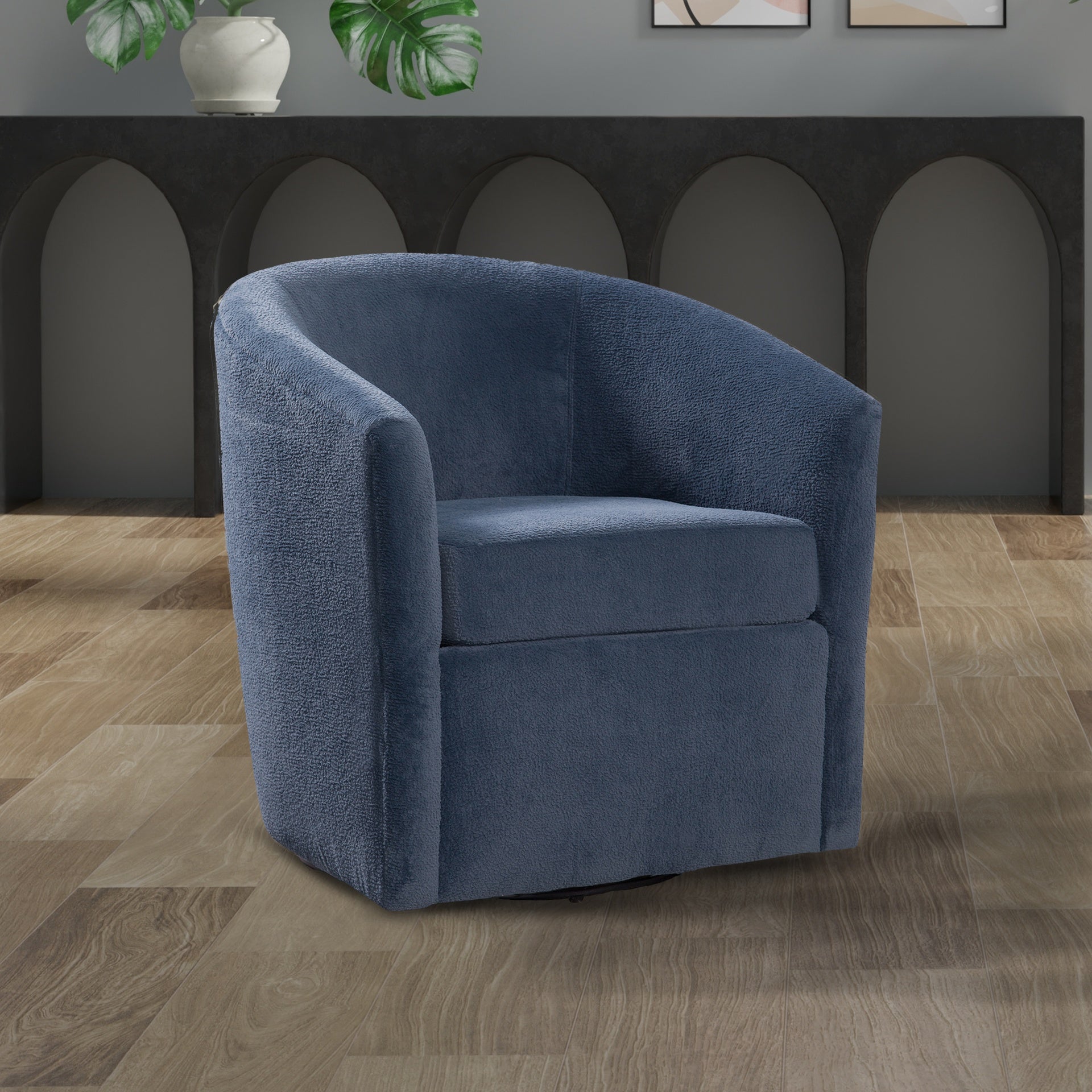 Oaklynn Barrel Style Swivel Accent chair in Navy Performance Fabric