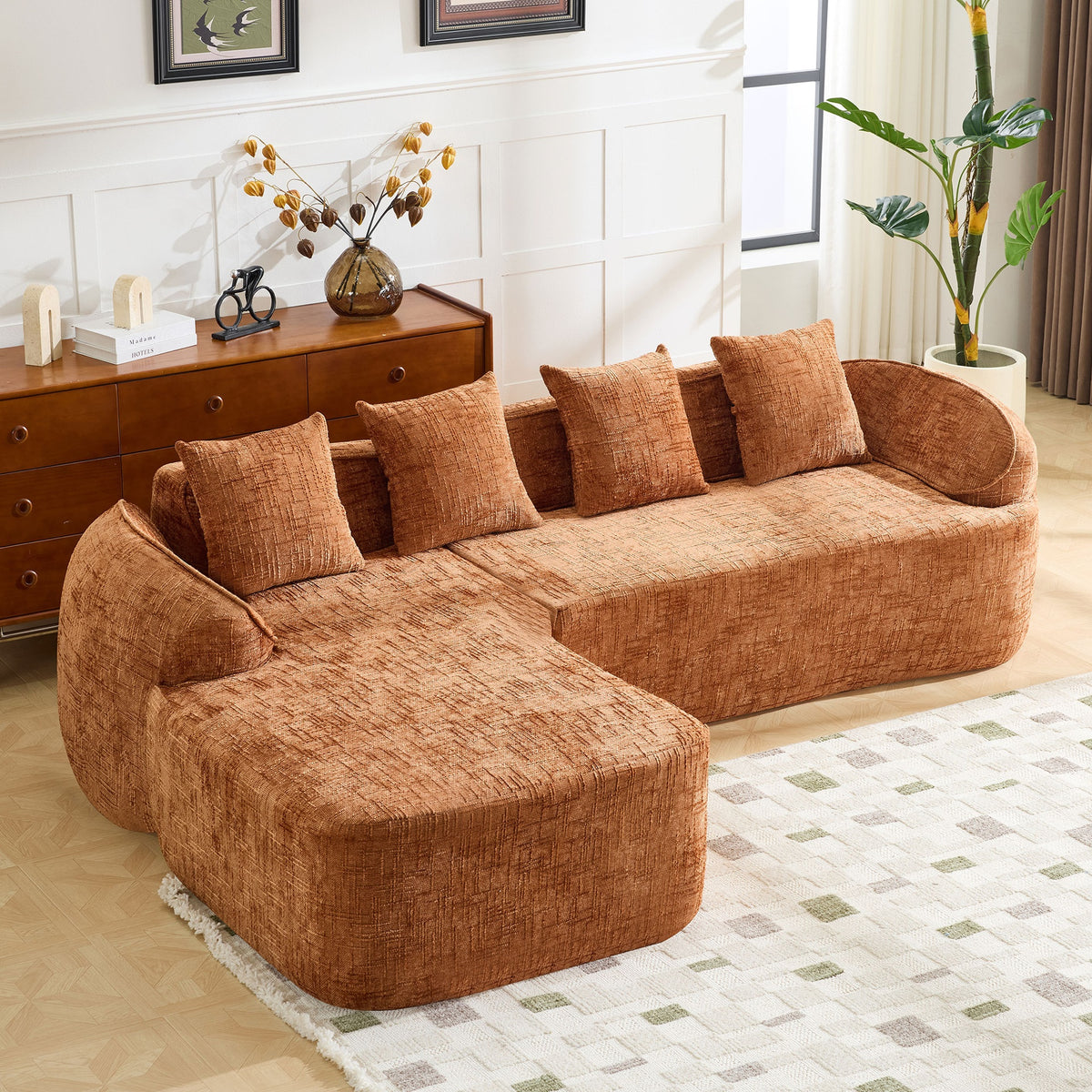 Orange chenille L-shaped compressed sofa that goes well with any living room. It features high-elastic sponge for a comfortable sitting feel,  curved armrests and four throw pillows.