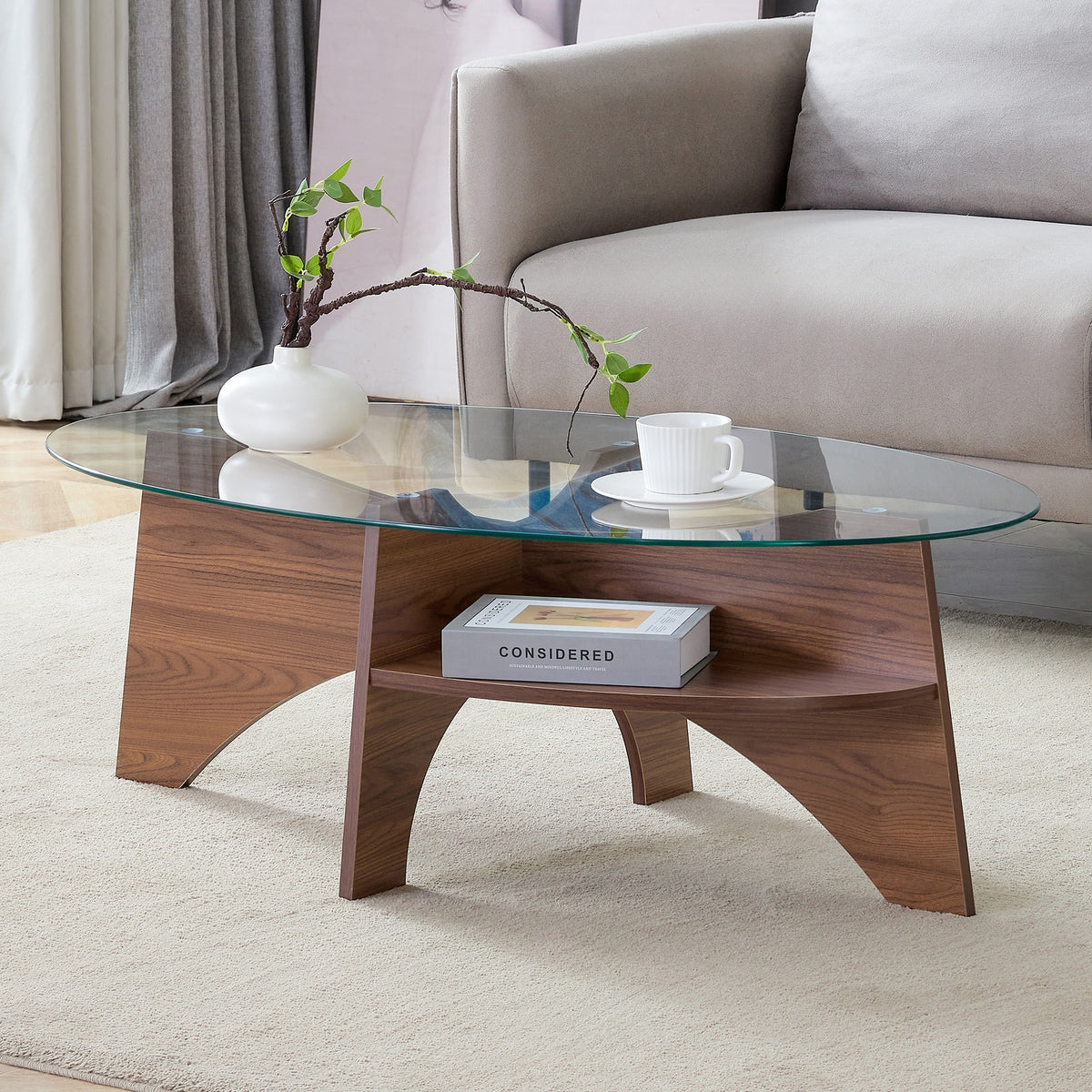 Oval Tempered Glass Coffee Table - 41.3"x23.6" Multi-Functional Design.Oval Tabletop.Walnut Wood Color Diagonal fan-shaped tray design Table Leg.Suitable for dining rooms, living rooms, offices.