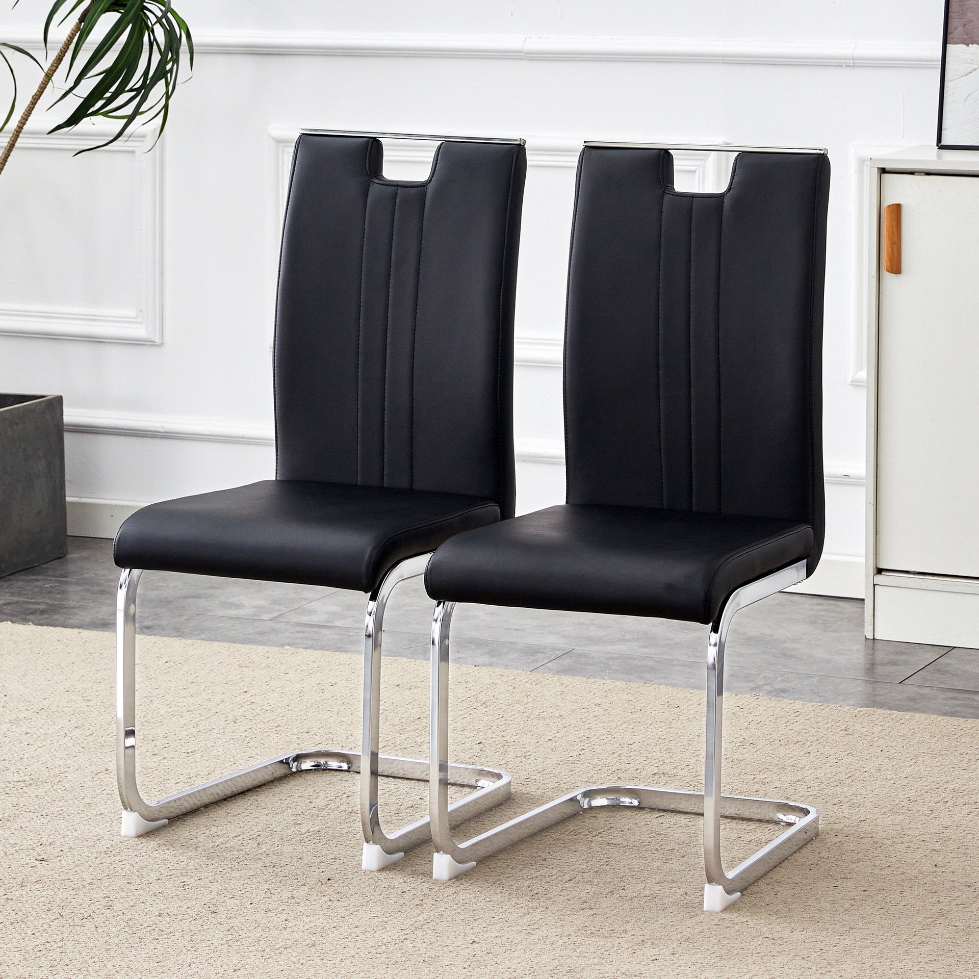 Set of 2 black PU material bow-shaped chairs - Perfectly integrated into industrial and modern home design