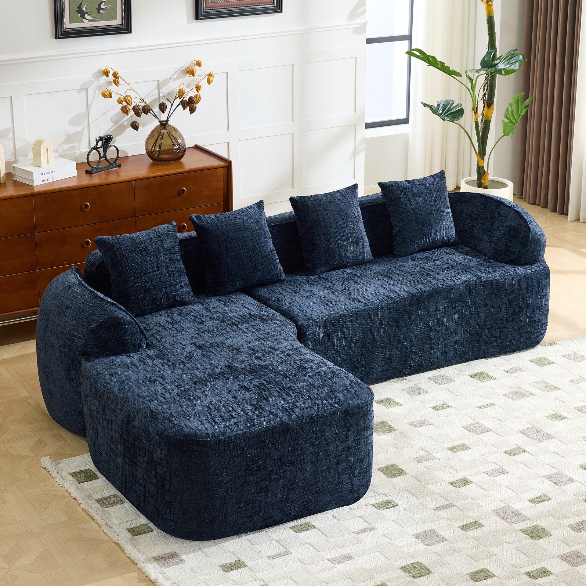 Dark bule chenille L-shaped compressed sofa that goes well with any living room. It features high-elastic sponge for a comfortable sitting feel,  curved armrests and four throw pillows.