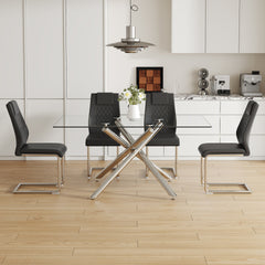 Table and chair set.Modern Luxurious Transparent Tempered Glass Dining Table Set with 4 Chairs.Single Fork Silver Metal Table Legs.Black high-quality PU dining chairs with silver metal legs.