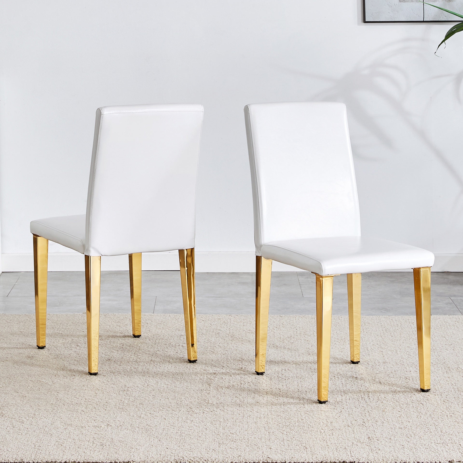 Set of 2 white PU leather backrest chairs with gold metal legs -A perfect match, suitable for minimalist and contemporary home decor styles, with product dimensions of 16.2*18.5*34.6 inches.