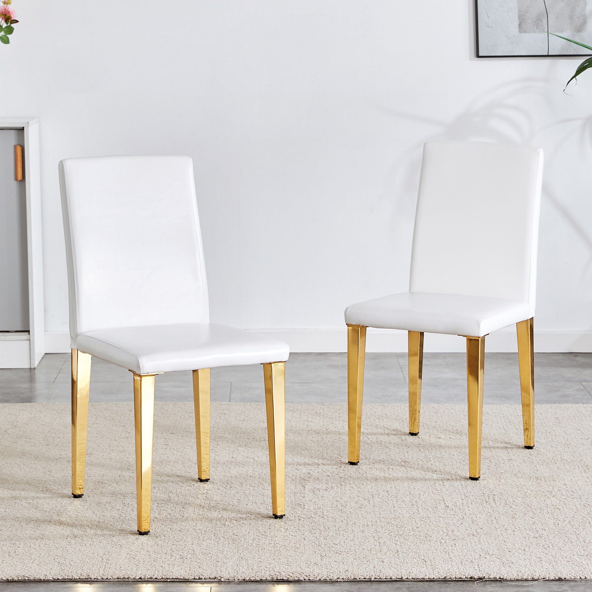 Set of 2 white PU leather backrest chairs with gold metal legs -A perfect match, suitable for minimalist and contemporary home decor styles, with product dimensions of 16.2*18.5*34.6 inches.