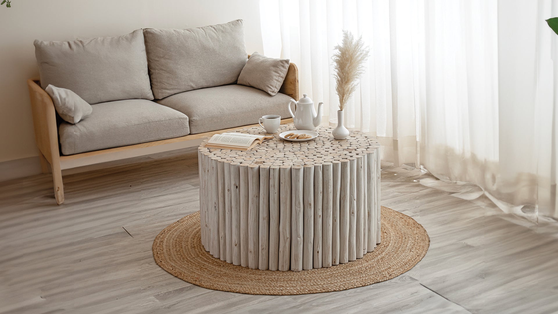 T1009 handcrafted round coffee table made from natural wooden logs featuring a detailed carved top, earthy charm in White