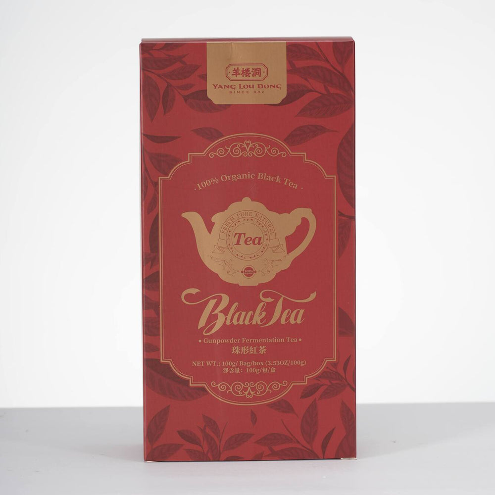 Red tea box with gold design on a white background