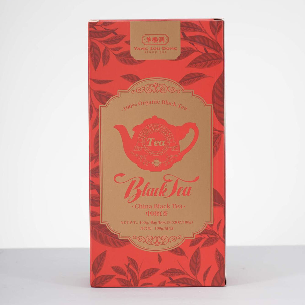 Red tea box with gold accents on a white background