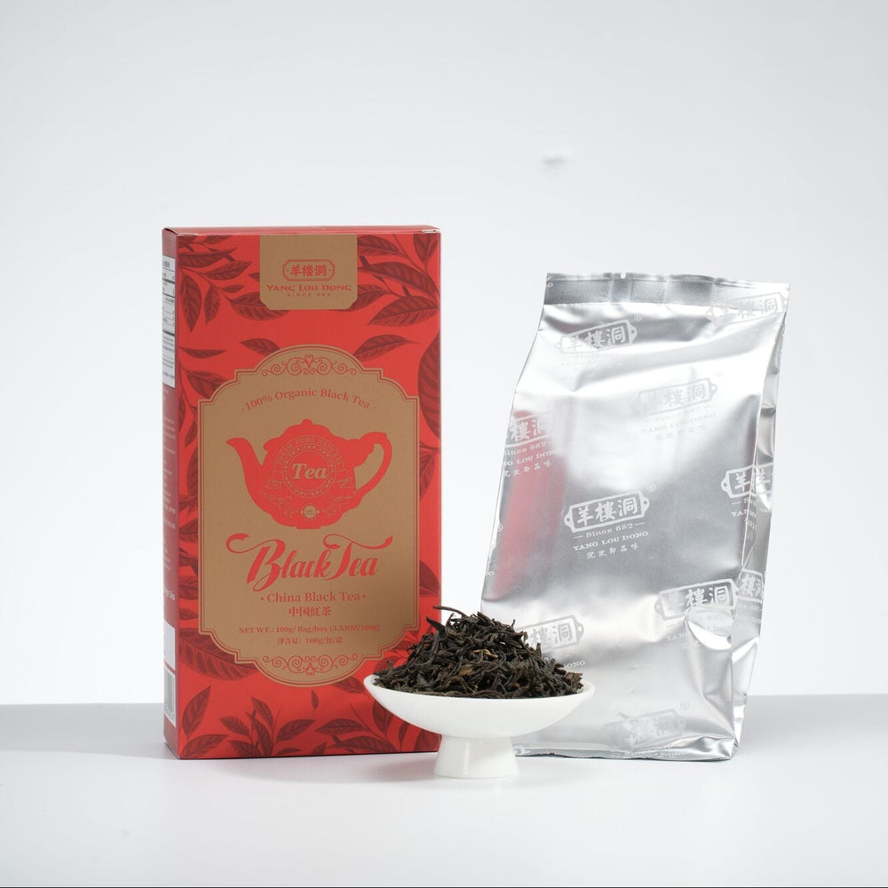 Red tea box and silver tea bag on a white background