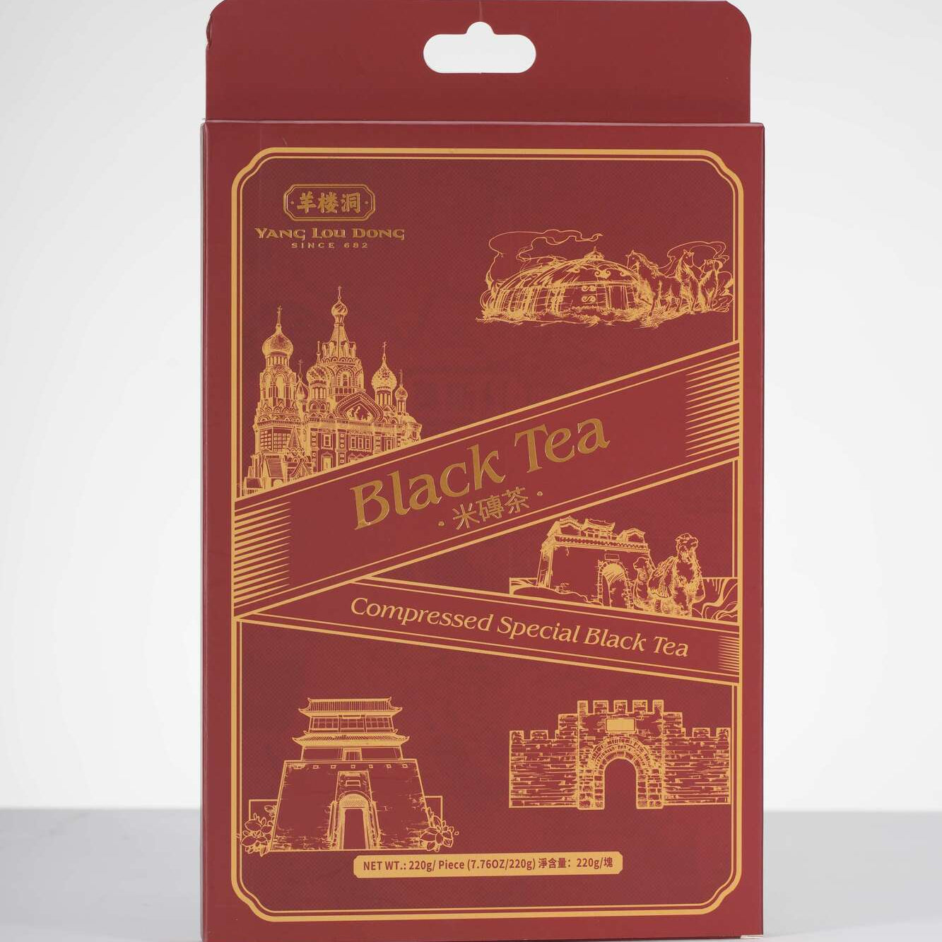 Red packaging of compressed special black tea with architectural illustrations on a white background