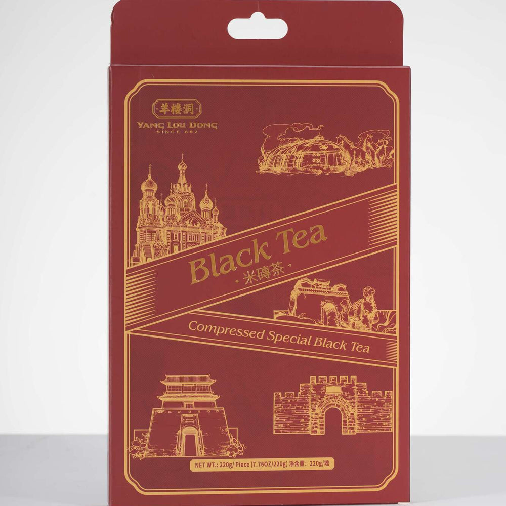 Red packaging of compressed special black tea with architectural illustrations on a white background
