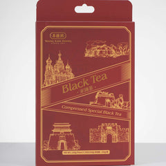 Red packaging of compressed special black tea with architectural illustrations on a white background