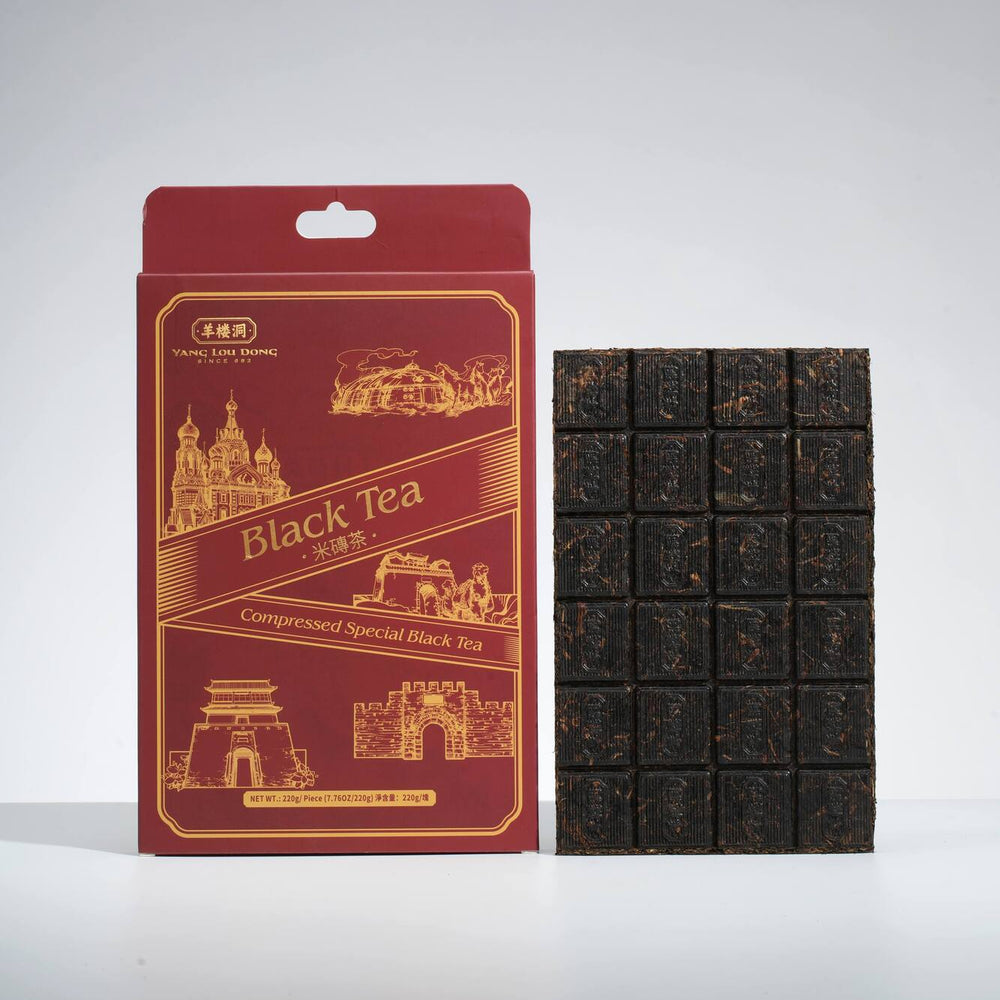 Red packaging of black tea with a gray background